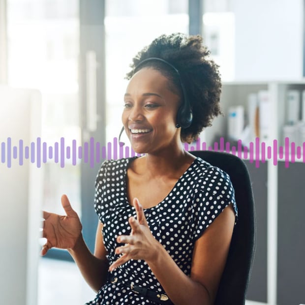 Photo of a call center agent talking to a customer on her headset. In the background are a series of small purple "sound waves" representing communications.